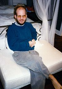 Andy posing for a snapshot in one of his parents' guest rooms, Feb. 1997