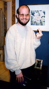 Andy's playfully rebellious reaction to me taking his picture, at his father and step-mother's house, Feb. 1997